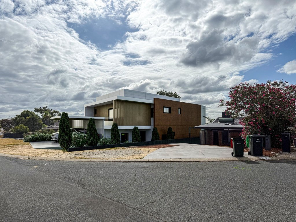 Design concept render of a two-storey home with corten and white panel cladding on a Perth street