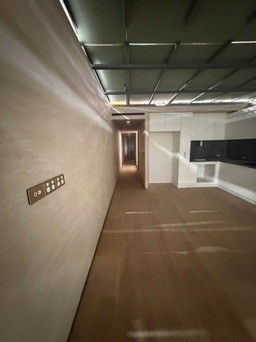 Finished hallway running the length of a module