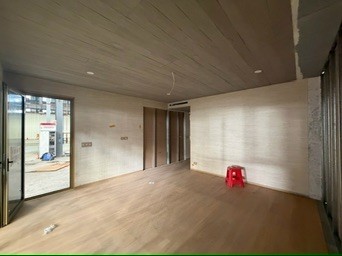 Fitted-out living space inside a module, with timber floor and sliding door