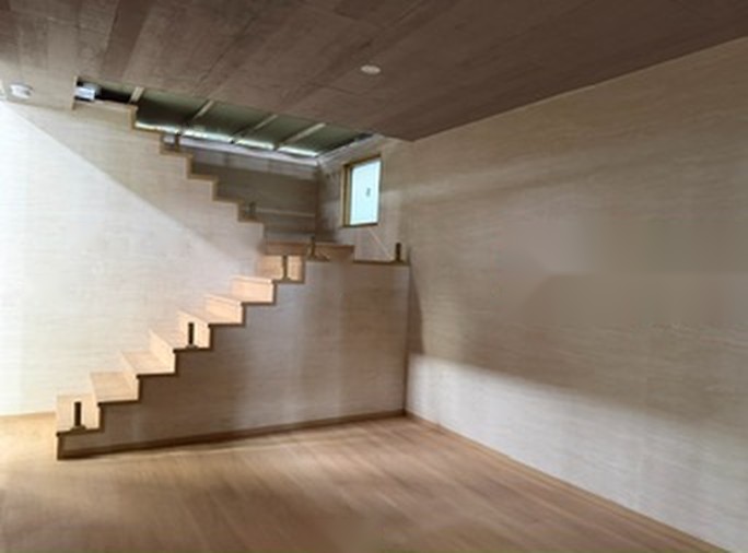 Timber staircase inside a two-level module