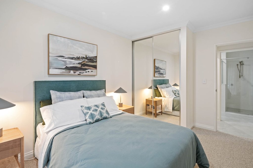 The Magnolia display home: bedroom with mirrored robe and ensuite